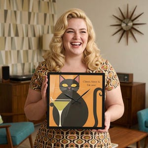 May include: Square black framed wall clock with a black cat illustration, a martini glass, and the text "Classy, Sassy & Fat assy" on an orange background. The clock has black hands and yellow eyes.