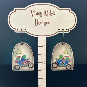 Frog and Toad on Tandem Bicycle Hand painted Wooden Earrings– Cottagecore Book Jewelry - Stainless Steel Hypoallergenic- Choice of Finish