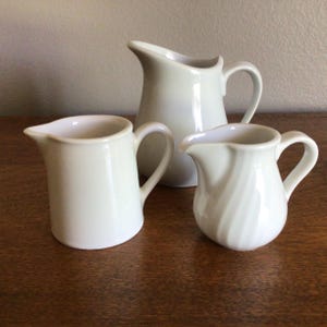 vintage set of (3) Ironstone creamers, creamery