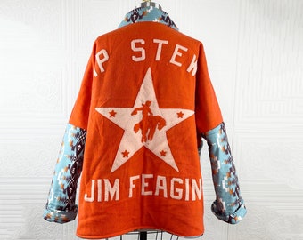 May include: Orange wool jacket with a large white star and the text "P STEK JIM FEAGIN" on the back. The sleeves are made of a blue and brown patterned fabric.