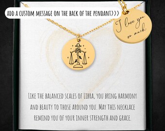 May include: Gold necklace with a Libra zodiac pendant and a smaller round pendant with the text "I love you so much". The necklace is in a box with a message about the Libra zodiac sign.