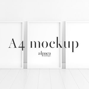 May include: Three white picture frames with a white background. The frames are arranged in a row, with the middle frame slightly overlapping the other two. The middle frame has the text "A4 mockup" and "alpaca mockups" printed on it.