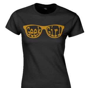 May include: Black t-shirt with a gold graphic of sunglasses that say "Geek Girl" on the front.