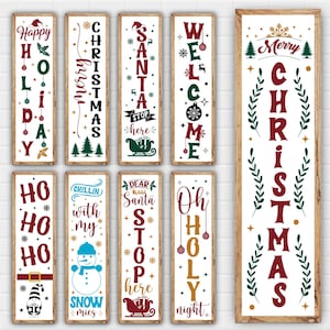 Puede incluir: Diez letreros de madera con temática navideña con diferentes saludos navideños. Los letreros son todos blancos con letras y decoraciones rojas, verdes y doradas. Los letreros presentan frases como "Feliz Navidad", "Felices Fiestas", "Bienvenido", "Santa Claus Detente Aquí", "Oh Noche Santa" y "Ho Ho Ho".