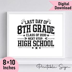 May include: A white rectangular sign in a thin white frame featuring black text that reads: LAST DAY OF 8TH GRADE CLASS OF 2030 NEXT STOP: HIGH SCHOOL. The design includes decorative stars and lines. The sign measures 20.32 by 25.4 cm in size.