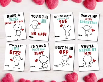 May include: Eight printable Valentine's Day cards with funny slang phrases and stick figure illustrations. The cards feature phrases like "Have a Skibidi Valentine's Day", "You're the Vibe, No Cap!" and "You're My Bussin Valentine".
