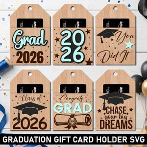 May include: Wooden graduation gift card holders with various designs. The designs include "Grad 2026", "2026", "You Did It", "Class of 2026", "Congrats GRAD", and "Chase your big dreams". Each holder has a pocket for a gift card.