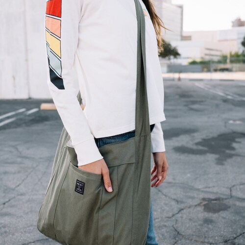 Messenger Bag- A portion of these proceeds shops goes to support the amazing foundation Working Wardrobes