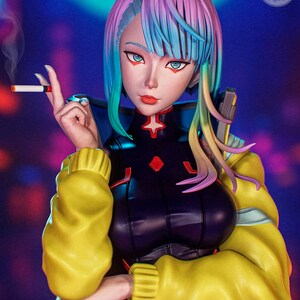 May include: A detailed figure of a woman with vibrant, multicolored hair and striking blue eyes, holding a lit cigarette. She wears a black and red outfit with a yellow jacket. The figure is a collectible item, with the text "DeaCh Figure" visible.