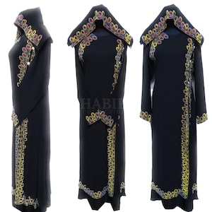 May include: Black abaya with a long-sleeved hooded design. The abaya features intricate embroidery with colorful beads and sequins in a floral pattern. The embroidery is on the hood, sleeves, and hem of the abaya.