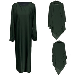 May include: A dark green long-sleeve dress with a round neckline and a matching shawl. The dress has a simple, elegant design. The shawl is layered and flowing, creating a sophisticated look. The dress and shawl are made of a soft, flowing fabric.