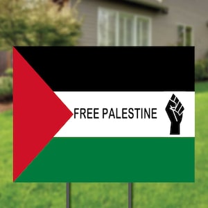 May include: A black, white, green, and red flag with the text "FREE PALESTINE" and a black fist raised in the air.