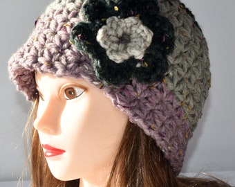 Woman’s crochet beanie with flower, multicolor, fits teen/adult 22-24” circumference.