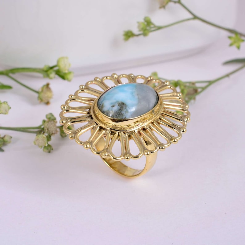 Gorgeous Larimar gemstone ring surrounded handcrafted Brass floral pattern.