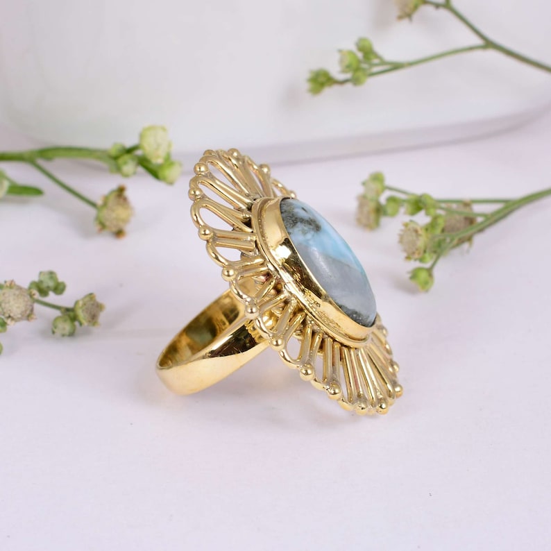 Gorgeous Larimar gemstone ring surrounded handcrafted Brass floral pattern.