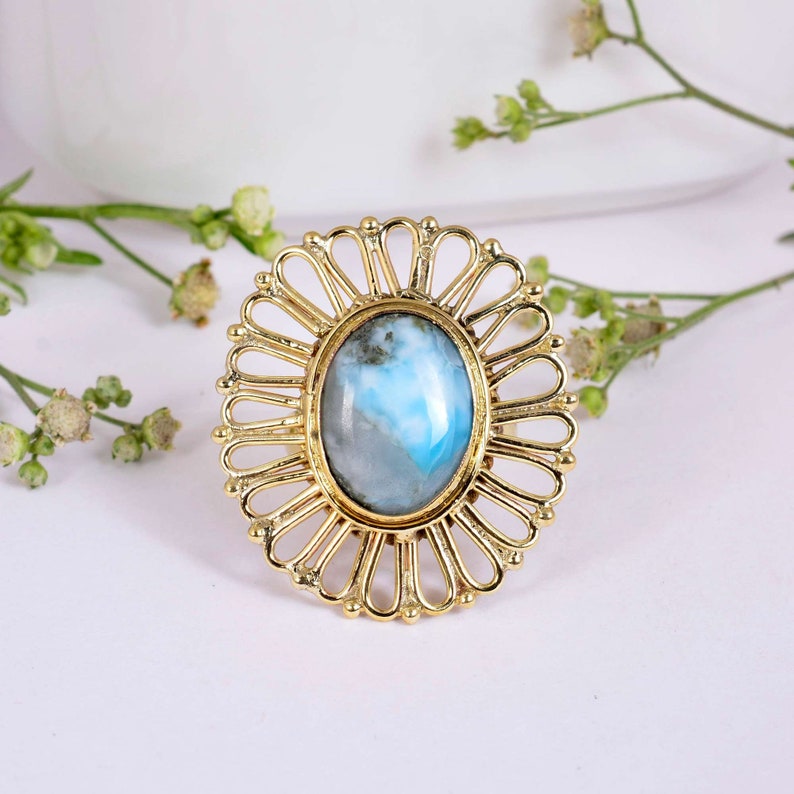 Gorgeous Larimar gemstone ring surrounded handcrafted Brass floral pattern.