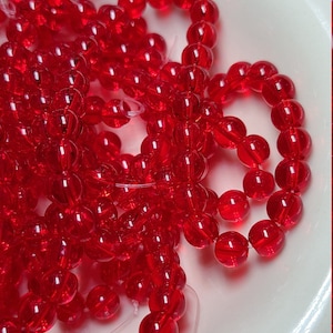 6mm Red Glass Beads, 11 inch strand - Item Number 1850