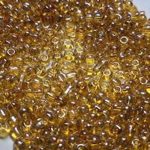 6/0 Transparent Luster Light Gold Seed Beads, 4mm Rocailles, 20 grams - Item Number 6139