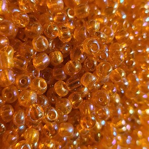 6/0 Transparent Orange Seed Beads, 4mm Rocailles, 50 grams - Item Number 6100