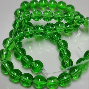 6mm Green Glass Beads, 11 inch strand - Item number 2918