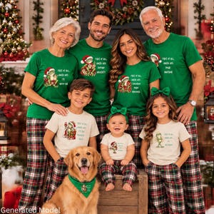 May include: A family wearing matching green and cream t-shirts featuring a frog wearing a Santa hat and the text First of all, Santa says. The adults wear green shirts with plaid pants, while the children wear cream shirts with plaid pants.