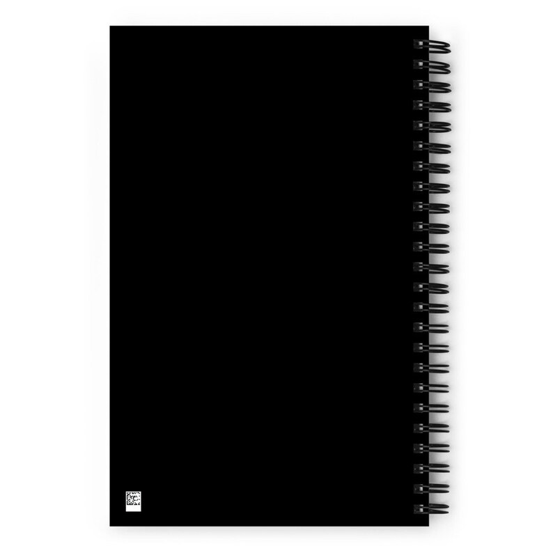 May include: Black spiral bound notebook with a black cover.