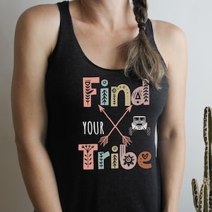May include: Black tank top with a colourful graphic that says "Find Your Tribe" with a stylised off-road vehicle and arrows.