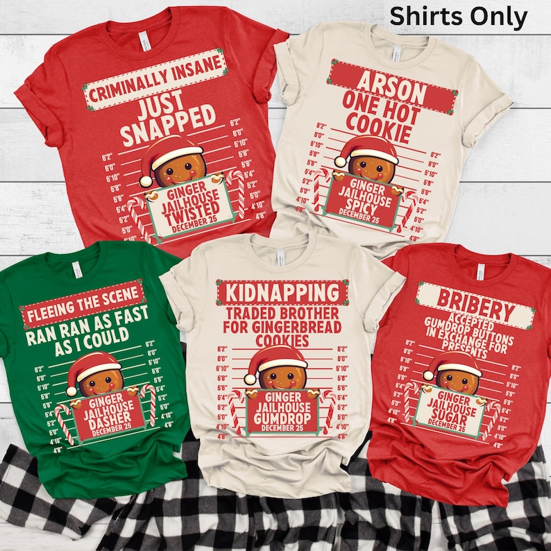 May include: A collection of Christmas-themed t-shirts in red, green, and cream colors. Each shirt features a gingerbread man design with humorous text like "Criminally Insane" and "Arson One Hot Cookie". The shirts have a jailhouse lineup graphic.