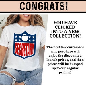 May include: White t-shirt with a red, white, and blue graphic of a football helmet with a red apple and the word "SECRETARY" in red letters.