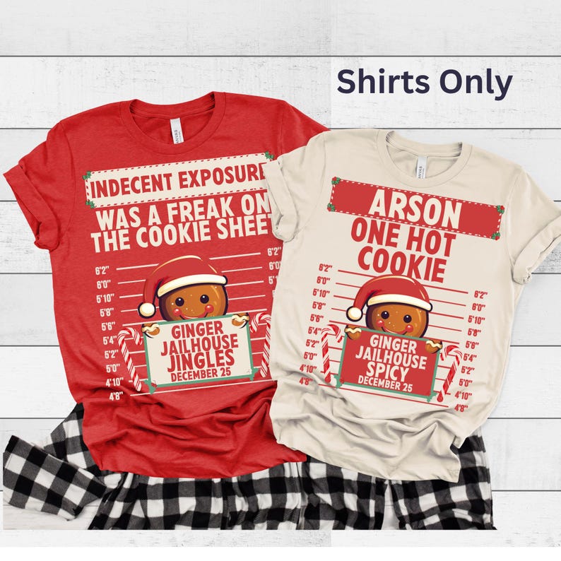 May include: Two Christmas-themed t-shirts. One red shirt with the text "INDECENT EXPOSURE WAS A FREAK ON THE COOKIE SHEET" and a gingerbread man graphic. The other is a cream-colored shirt with "ARSON ONE HOT COOKIE" and a gingerbread man graphic.