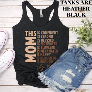 May include: Black tank top with the text "This Mom is confident, strong, blessed, motivated, elevated, melanated, happy, beautiful, enough is enough" in brown text.