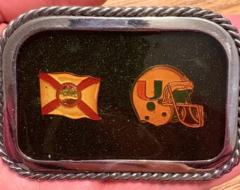 Vintage University of Miami Hurricanes “The U” Helmet and Flag Belt Buckle – Glitter Enamel Background – Rare 1980s Style