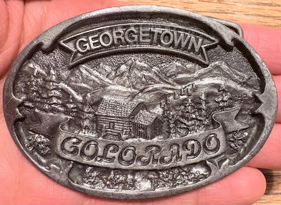 Vintage 1983 Georgetown Colorado Belt Buckle – Hand Carved by Paula Freed – Ultra ENT Inc.