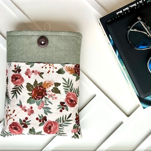 Green and floral book sleeve with pocket for glasses or e-reader