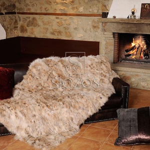 Fur blanket of natural lynx fur,with slip-resistant lining.