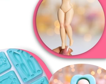 Op de afbeelding: Een blauwe siliconen mal met meerdere holtes voor het maken van poppenfiguren. De mal heeft een hartvorm aan de bovenkant van elke holte. Een afgewerkt poppenfiguur is te zien op de achtergrond.
