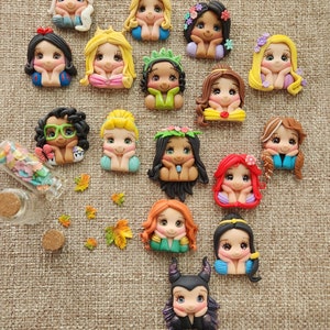 May include: A collection of 15 handmade polymer clay Disney princess character charms. Each charm features a different princess with a unique expression and pose. The charms are perfect for adding a touch of magic to jewelry, crafts, and other projects.