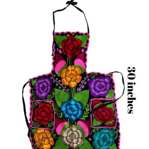 May include: A black apron with colorful embroidered flowers. The apron measures 22 inches wide and 30 inches long.