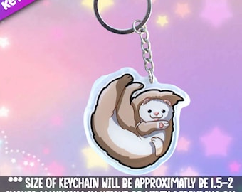 Fret-speelse sleutelhanger. Schattige pittige sleutelhangers om aan je favoriete items te hangen. Koop een sieraad dat een persoonlijke therapeut is