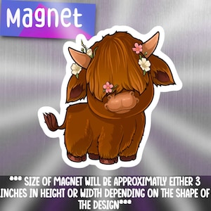 May include: A brown and white Highland cow with a flower crown, standing on a white background. The cow is looking down and has a sweet expression. The magnet is approximately 3 inches in height or width.