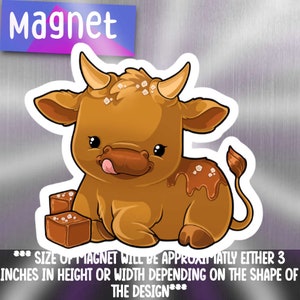 May include: A cartoon illustration of a brown cow with caramel sauce and sprinkles. The cow is licking its lips and has a happy expression. The image is a magnet, approximately 3 inches in height or width.