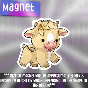 May include: A cute cartoon cow with a flower on its head. The cow is light brown with a white spot on its forehead and pink nose. The flower is yellow with a pink centre. The cow is smiling and has big eyes. The magnet is approximately 3 inches in height or width.