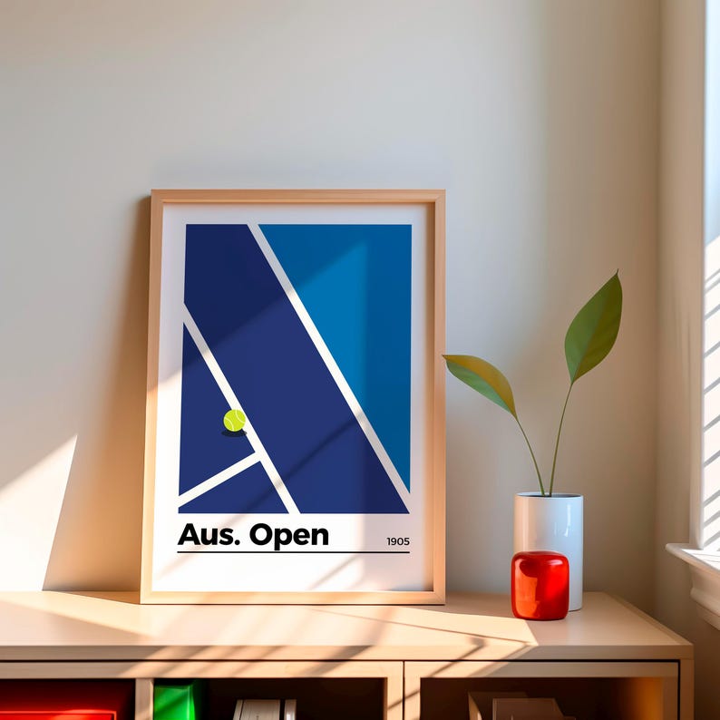 May include: A framed print of a blue and white tennis court with a yellow tennis ball. The print has the text "Aus. Open" and "1905" at the bottom.