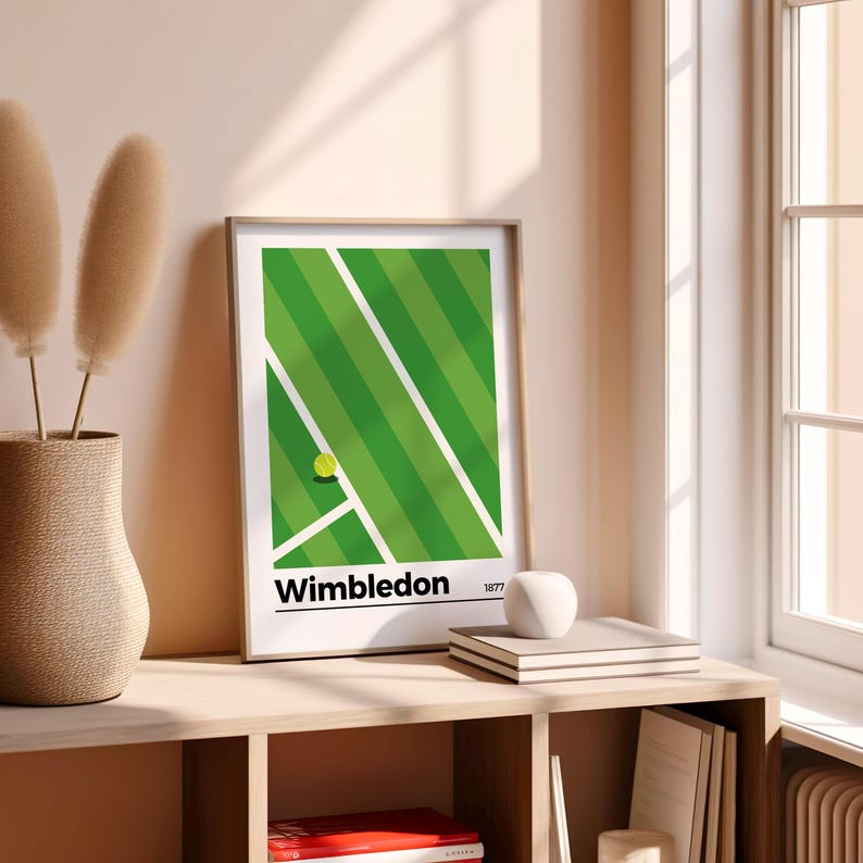 May include: A framed print of a green tennis court with a white line and a yellow tennis ball. The print has the text "Wimbledon 1877" at the bottom.