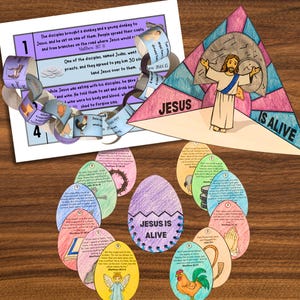 May include: A colorful Easter-themed craft kit featuring a triangular stained-glass design with the text "JESUS IS ALIVE." Includes illustrated egg cutouts with Bible verses, and a paper chain with Bible verses and illustrations.