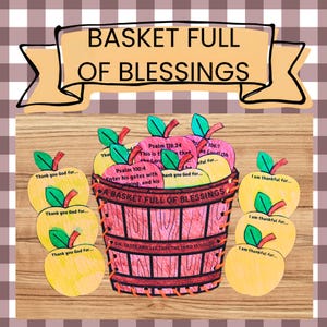 May include: A paper craft basket colored in shades of red and brown with the text A BASKET FULL OF BLESSINGS and OH, TASTE AND SEE THAT THE LORD IS GOOD. It is surrounded by yellow paper apples featuring green leaves and various religious text.