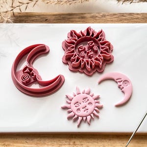 sun and moon polymer clay cutter set on white tile