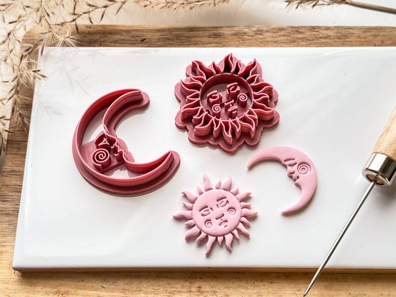 sun and moon polymer clay cutter set on white tile