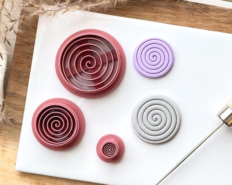 Circular shaped clay cutter with sprial stamp detail for polymer clay projects and fondant decoration