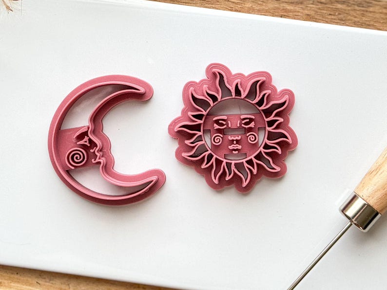 close up of celestial sun and crecent moon cutter set showing details.